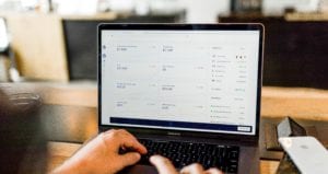 financial services sales data on laptop screen